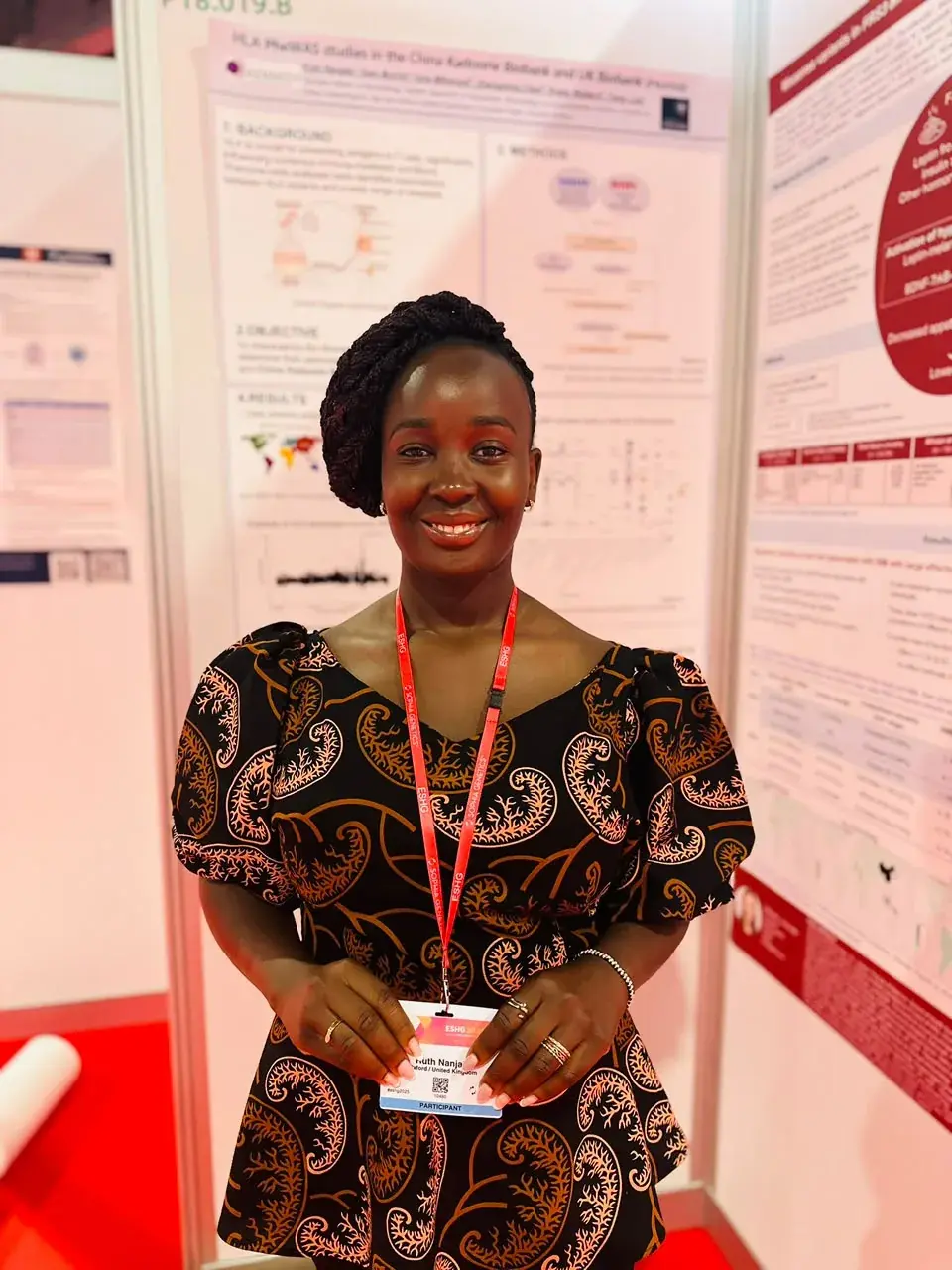 Ruth Nanjala standing in front of an academic poster presentation